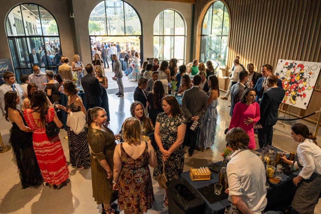 a social gathering or event held in a modern, industrial-style venue