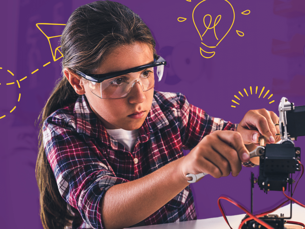 A young child wearing safety goggles is concentrating on an electronic project with tools, against a purple background with illustrated light bulbs and paper airplanes, embodying kids' entrepreneurial learning in the world of STEM.