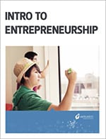 Textbook cover titled "Free Entrepreneurship Curriculum" showing a young man in a classroom, looking thoughtful with a pen in hand.