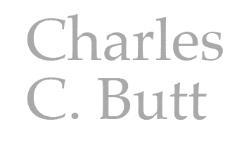 Text reads "Charles C. Butt" in a serif font against a transparent background, symbolizing his legacy in youth entrepreneurship education.