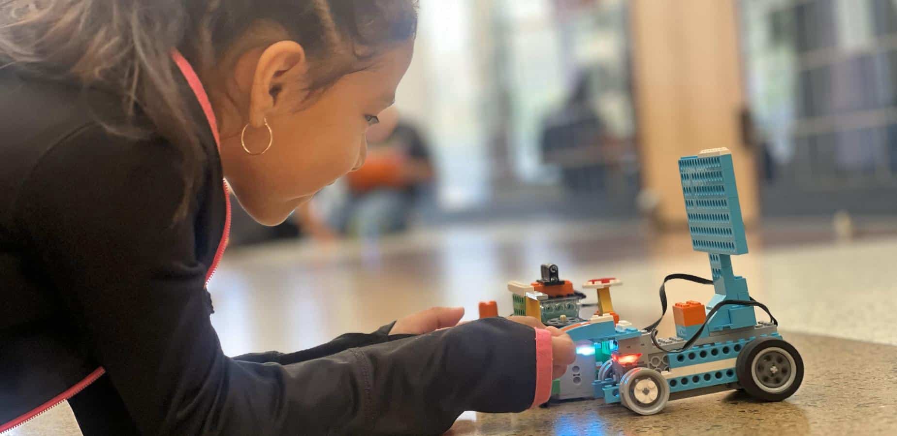 young girl working on stem project